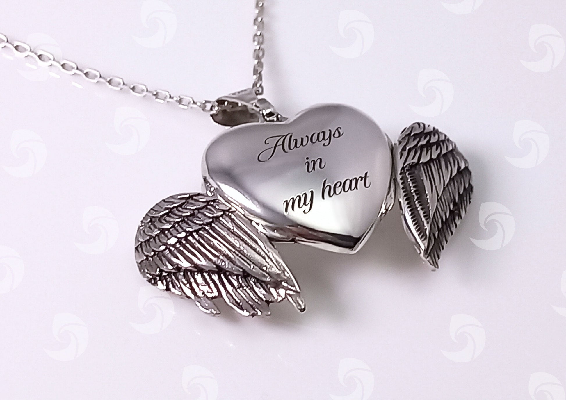 Breaking Waves Cremation Jewellery Angel Wings Heart Shape Sterling Silver Necklace with engraving on the back of a heart
